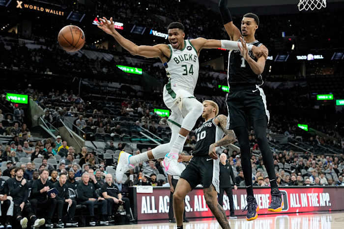 Jan 4, 2024; San Antonio, Texas, USA; Milwaukee Bucks forward Giannis Antetokounmpo (34) loses control of the ball while driving to the basket against San Antonio Spurs forward Victor Wembanyama (1) during the first half at Frost Bank Center.